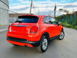 2016 Fiat 500X Easy Edition in vibrant orange, showcasing clean condition and stylish alloy wheels.