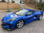 2021 Chevrolet Corvette C8 Z51 in showroom condition, blue exterior with sleek design, parked in driveway.