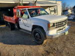 1993 GMC C3500 dump truck with visible wear and tear, suitable as a backup vehicle.