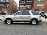 2013 GMC Acadia SLE in silver parked on street, featuring 3rd row seats for 7 passengers and backup camera.