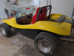 1970 Volkswagen Dune Buggy with racing seats and a roll bar, showcasing unique yellow exterior.