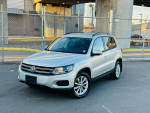 2015 Volkswagen Tiguan SE 4Motion AWD in silver, parked with clean exterior and alloy wheels.
