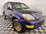 2008 Lexus GX 470 in dark blue with bronze TRD wheels and all-terrain tires, for sale with low mileage.