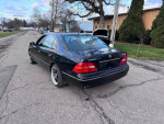 2002 Lexus LS 430 luxury sedan parked on the street, featuring clean body and alloy wheels.