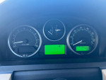 Dashboard of a 2006 Land Rover LR3 showing mileage and temperature readings.