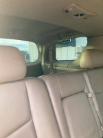 Interior view of a 2007 Cadillac SRX showing tan leather seats and spacious third row seating.