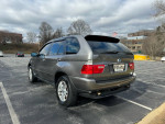 2006 BMW X5 3.0i AWD in grey with a well-maintained exterior and parking lot background