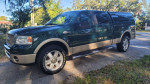 2008 Ford F150 King Ranch 4x4 in green, low mileage, clean title, features moonroof and backup camera.