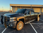 2012 Chevrolet Silverado 2500HD LTZ 4WD truck, black, clean with low mileage, ideal for towing.