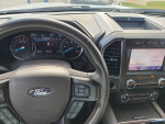 Interior view of a 2020 Ford Expedition Limited showing dashboard and infotainment system.