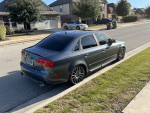 2007 Audi A4 2.0T FWD parked on street, featuring aftermarket modifications and in good condition.