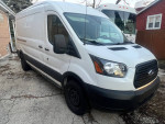 White 2016 Ford Transit 350 Van parked outdoors, featuring a high roof and sliding side door.