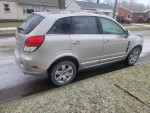 2009 Saturn Vue AWD in silver parked on street, showcasing clean exterior and reliable features for potential buyers.