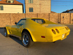 1974 Chevrolet Corvette in bright yellow, fully restored, showcasing classic design and excellent condition.
