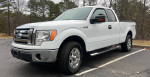 2009 Ford F150 XLT Supercab pickup truck with low mileage and excellent condition parked in a lot