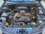 2006 Subaru Impreza engine compartment showcasing the clean and well-maintained mechanical components.