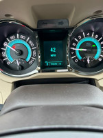 Dashboard of a 2011 Buick LaCrosse showing speed and mileage at 155,245 miles, well-maintained condition.