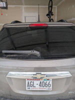 2011 Chevrolet Equinox rear view showing minor wear and license plate, available for sale with some repairs needed.