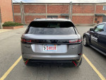 2020 Land Rover Range Rover Velar R-Dynamic S in Eiger Grey, rear view parked, showing minor scratches