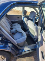 Interior of a 1995 Honda Civic DX showing clean and original upholstery in the rear seats.