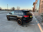 2015 Jeep Cherokee Limited in great condition parked with black alloy wheels and sunroof, showcasing its stylish design.