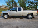 2006 GMC Sierra 1500 SLT 4x4 with aluminum block engine, dual power heated leather seats, and Cooper AT tires.
