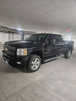 2014 Chevrolet Silverado 2500HD LTZ 4WD truck in black color, featuring leather seats and low mileage of 57,000.