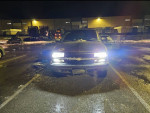 1999 Chevrolet Blazer parked at night, showcasing new headlights and low mileage tires.