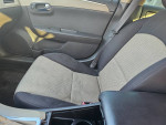 Interior view of 2010 Chevrolet Malibu with gray and black seats, highlighting its good condition and low mileage