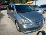 2006 Honda Odyssey minivan with cold AC for sale, mechanic special, 141,000 miles, in good condition.