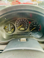 Dashboard view of a 2003 Subaru Impreza Outback Sport with low mileage and AWD features.