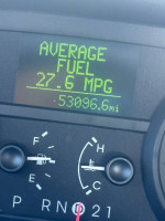 Dashboard display showing average fuel economy of 27.6 MPG on a 2008 Mercury Grand Marquis LS