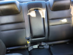 Back seats of a 2006 Monte Carlo in good condition with black leather upholstery.