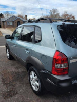 2005 Hyundai Tucson SUV in good condition with new tires and sunroof, available for sale.