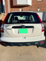 Rear view of a 2008 Honda CR-V in white, showcasing its excellent condition and low mileage for sale.