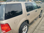 2004 Ford Explorer SUV side view, 126,000 miles, clean, 4x4, third-row seating, ready for new owner.