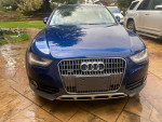 Front view of a blue 2013 Audi A4 with minor scratches, 115,000 miles, ready for new owner.