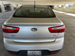 2012 Kia Rio with low mileage in good condition, parked in a garage