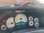 Dashboard of a 2004 GMC Yukon showing 89,826 miles, airbag and ABS lights illuminated.