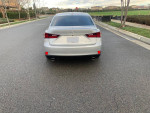 Rear view of a silver 2014 Lexus IS 250, excellent condition, parked on a residential street.