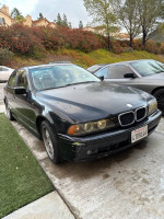 2001 BMW 530i parked, requiring engine repair, with good body condition and recent part upgrades.
