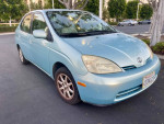 2001 Toyota Prius in blue color parked, with clean exterior and reliable gas mileage.