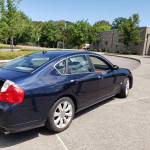 2007 Infiniti M35 in dark blue parked, showcasing sleek design and clean lines with excellent visibility.