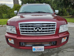 Front view of a 2010 INFINITI QX56 SUV in excellent condition, showcasing its clean design and chrome grille.