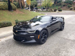 2017 Chevrolet Camaro 2LT Convertible in black, stylish design, parked on the street with palm trees