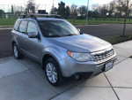 2011 Subaru Forester limited edition with winter package parked on a street, showcasing its sleek design and features.