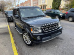 2014 Land Rover LR4 HSE 4WD parked on the street, showcasing black exterior and spacious design.