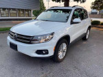 2016 Volkswagen Tiguan S 4Motion AWD in white, featuring alloy wheels and a sleek design.