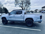 2021 Toyota Tacoma SR5 4X4 Off-Road, double-cab with low mileage, parked in a lot.