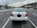 2011 Subaru Impreza parked in a lot, features clean title, AWD, heated seats, and sunroof.